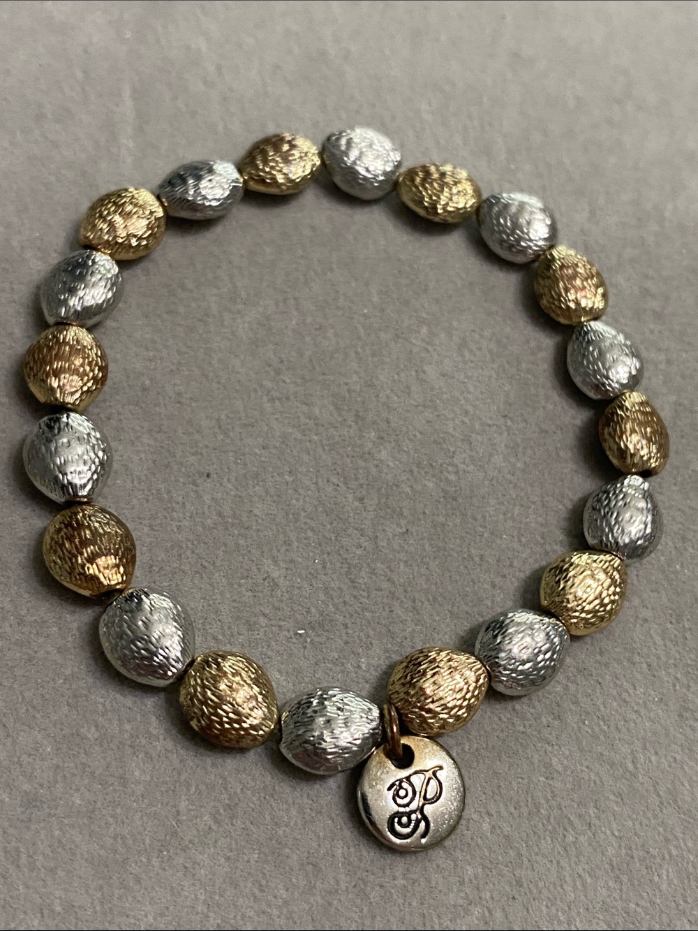 Plunder Two-Tone Gold and Silver Textured Bead Bracelet with Signature Charm